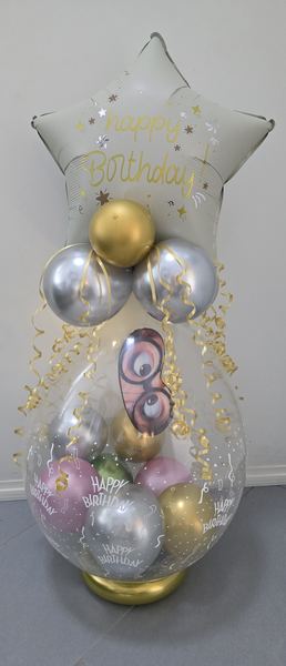Geschenkballon Hameln · Verpackungsballon zum Geburtstag in Metallic-Bunt mit Stern-Folienballon